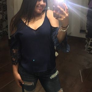 a cute blue shirt w open shoulders